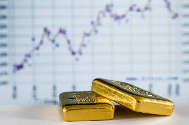 istock Gold bars on the background of the growth chart. 1273634696
