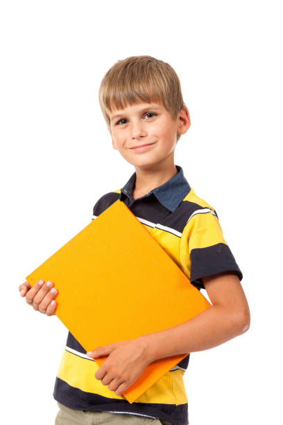istock Schoolboy holding books 1273639865