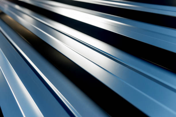 istock Gray metallic roof tiles background with light pattern. 1273640521