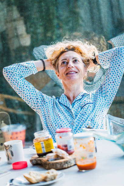 istock Blonde woman at breakfast time. 1273645276