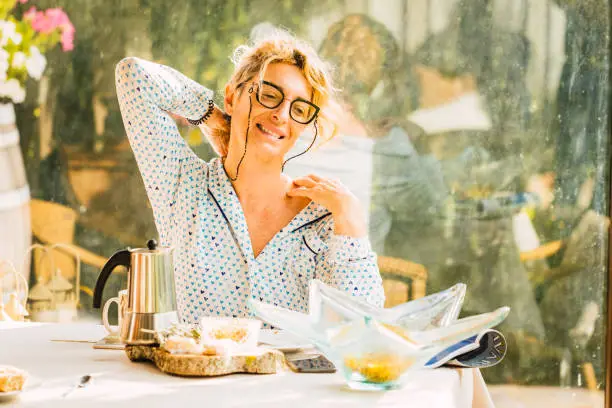 Photo of Blonde woman at breakfast time.