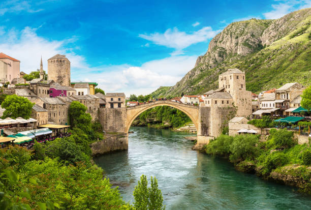 The Old Bridge in Mostar Panorama of The Old Bridge in Mostar in a beautiful summer day, Bosnia and Herzegovina mostar stock pictures, royalty-free photos & images