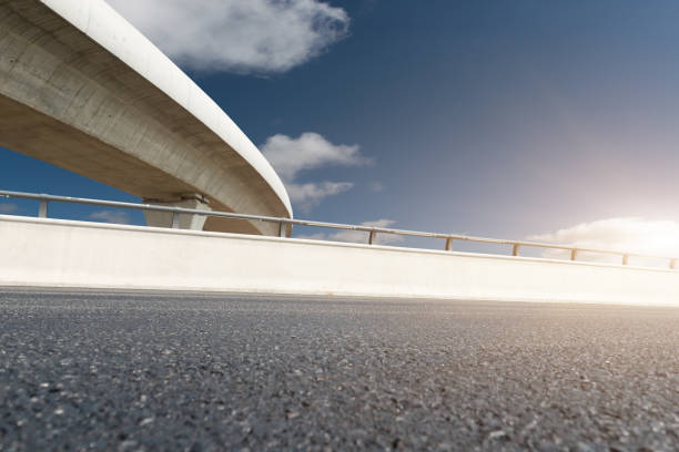 istock Clear sky, highway pavement under the overpass 1273657411