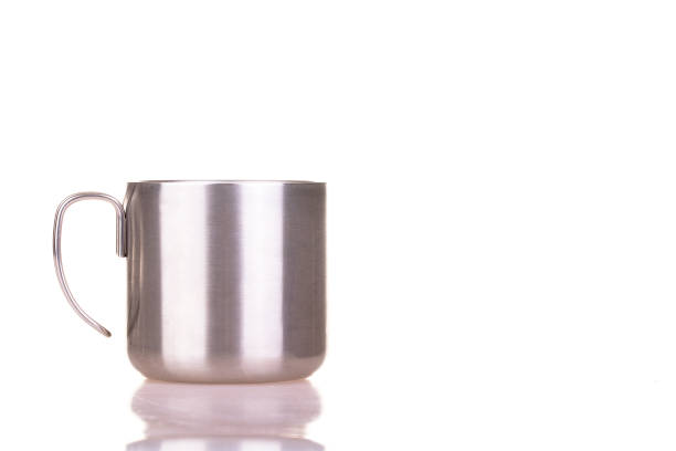 istock Metallic mug isolated on white background with free space for logo 1273664895