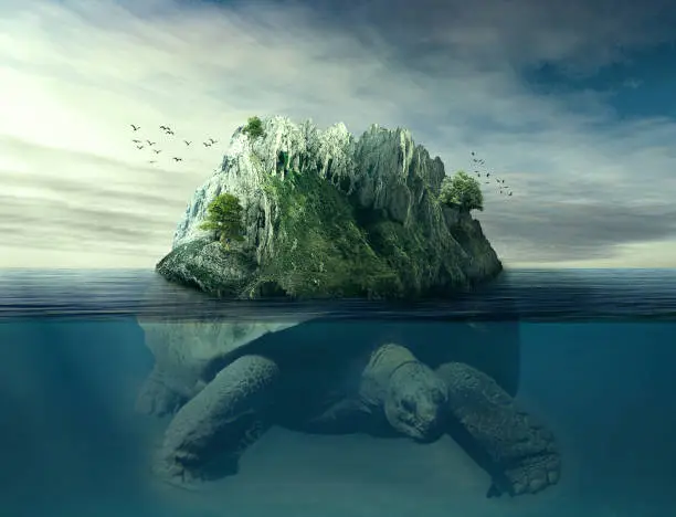 Photo of Giant turtle carrying island on the back swimming under the ocean surface in blue water.