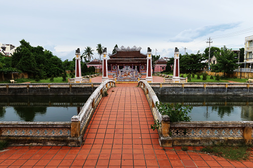 Hoi An, Vietnam, September 20, 2020: Access bridge to the Van Mieu Confucius Temple compound. Hoi An, Vietnam