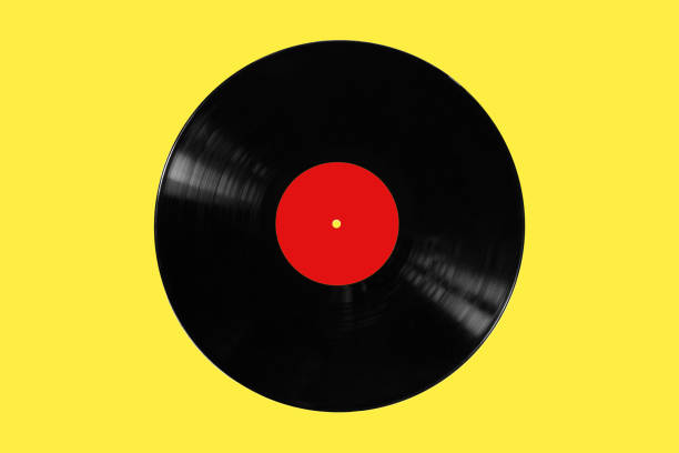 istock Vinyl record isolated on a yellow background. View from above. 1273666059