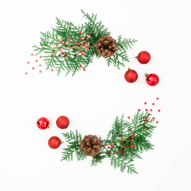 istock Christmas frame of pine branches and red decoration on white background. Flat lay, top view 1273667151
