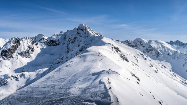 istock View from Kasprowy Wierch on adventurers climbing on Swinica mountain peak 1273668968