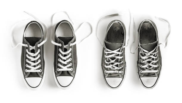 istock New and old black sneakers isolated on white background 1273673647