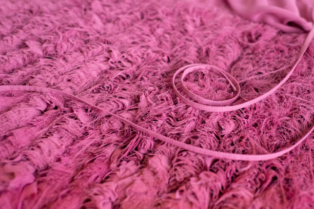 istock Cyclomen color textile background. On the fleecy light texture, the stitched ribbons are beautifully laid out in tone. Elegant pink textures. 1273675973