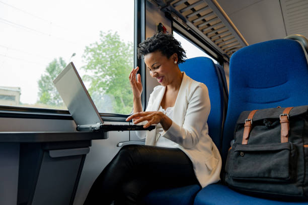 istock Afro-American woman using laptop and smiling 1273676289