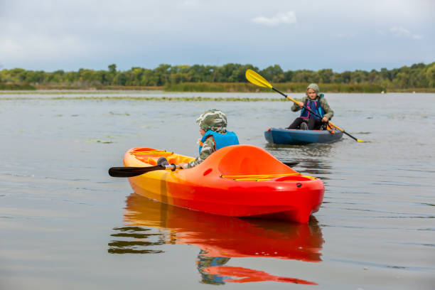 istock Two Children Kayaking on Lake in Autumn 1273679928