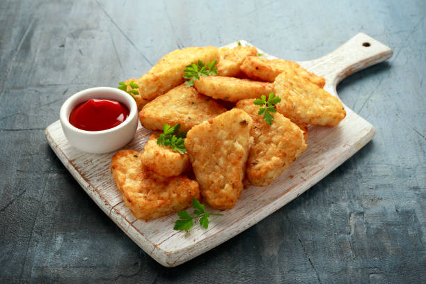 Hash brown potato with ketchup on white wooden board Hash brown potato with ketchup on white wooden board. hash brown stock pictures, royalty-free photos & images