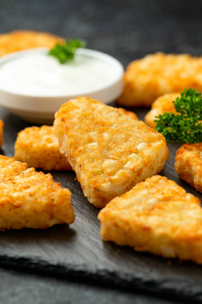 istock Hash brown potato patties on rustic stone board 1273683862