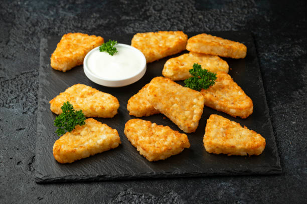 istock Hash brown potato patties on rustic stone board 1273683929