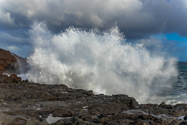 istock Big waves on the rocky coast. Hawaii 1273686372
