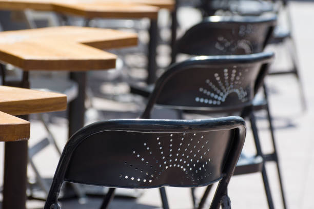 istock Empty in a city cafe. The chairs close up. 1273686411