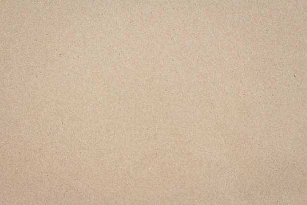 istock Brown paper background texture light rough textured spotted blank copy space 1273692286