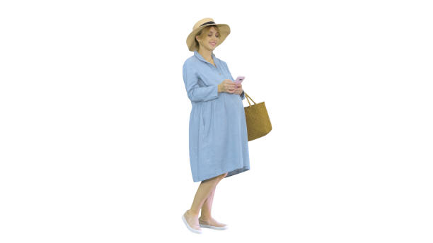 istock Pregnant woman on the 9th month using a smartphone on white back 1273693935
