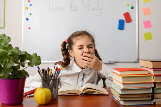 Young learner wants to take a brake and have some rest Concept of studying, intelligence, school boring homework twelve stock pictures, royalty-free photos & images