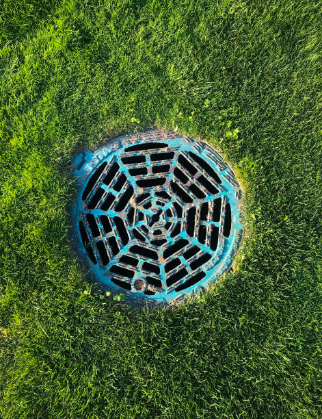 istock Blue water drain hatch on golf course with grass background 1273697636