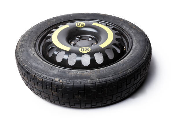 istock New car spare wheel tire isolated on white background. 1273698698
