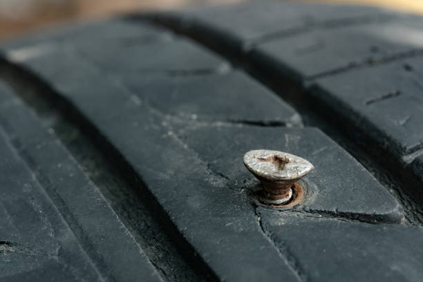istock Metal screws nails embroidered in tires 1273699154