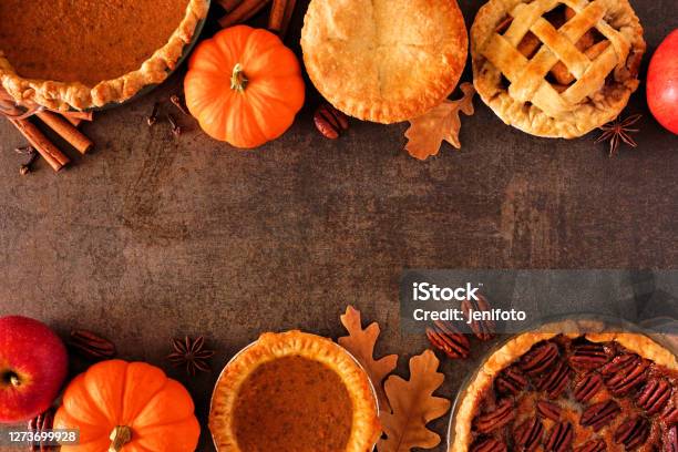 Assortment Of Homemade Autumn Pies Double Border On A Dark Stone Background Stock Photo - Download Image Now