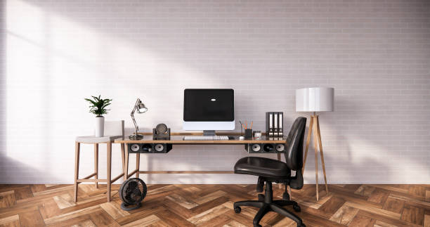 istock Computer and office tools on desk in room interior loft style with white brick wall on wooden floor.3D rendering 1273707541