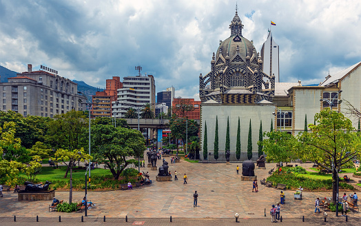 Cityscape over Plaza Botero Square with people walking, Medellin, Colombia.