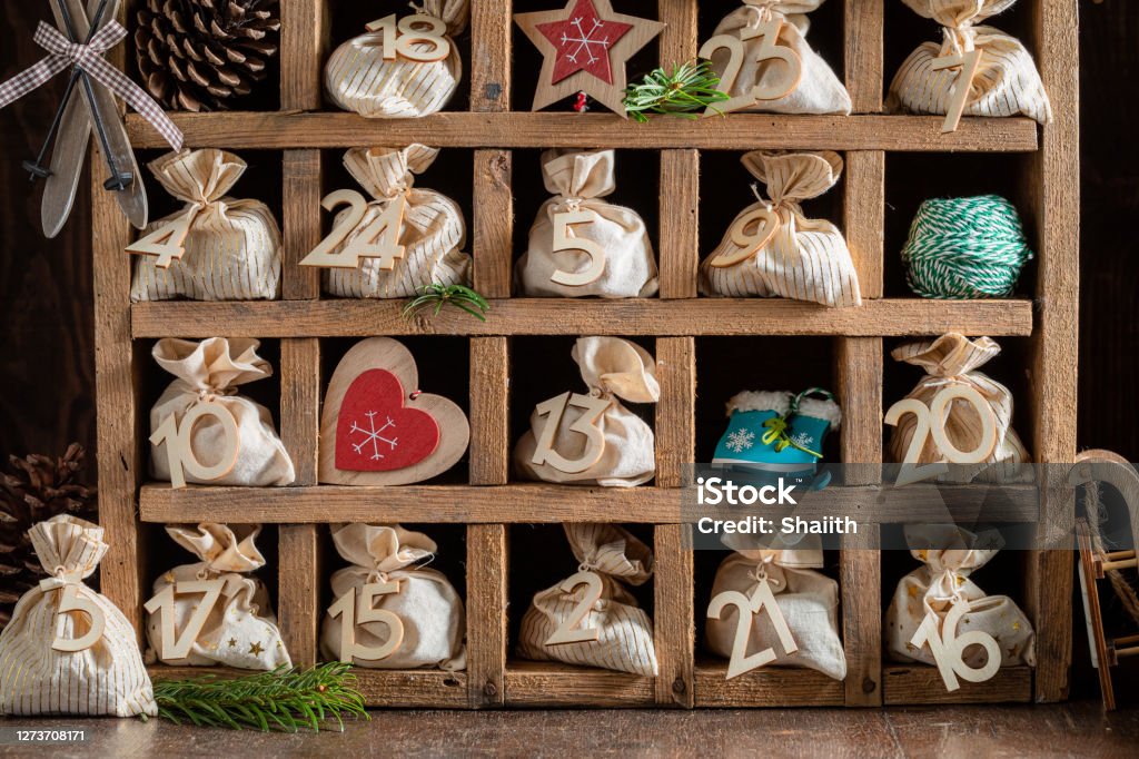 Original Advent Calendar for Christmas with twenty four bags Original Advent Calendar for Christmas with twenty four bags on dark background Advent Calendar Stock Photo