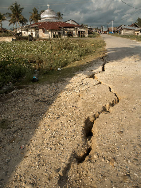 istock Damaged and Cracked road surface after earthquake 1273711489