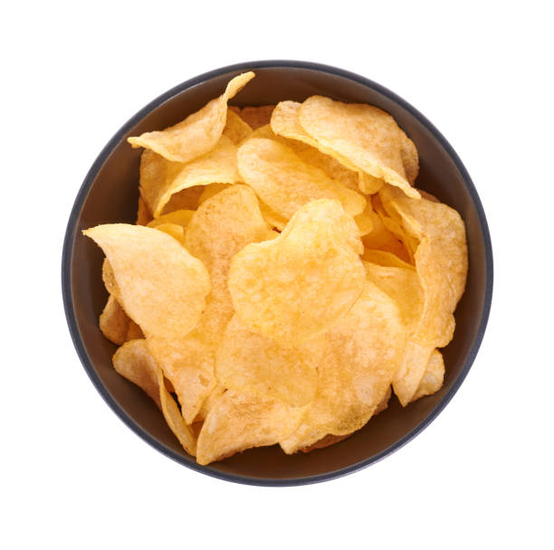 istock Golden potato chip in dark bowl, isolated on white background. 1273713093