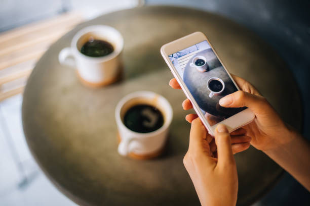 istock Blogger photographing coffee 1273728352