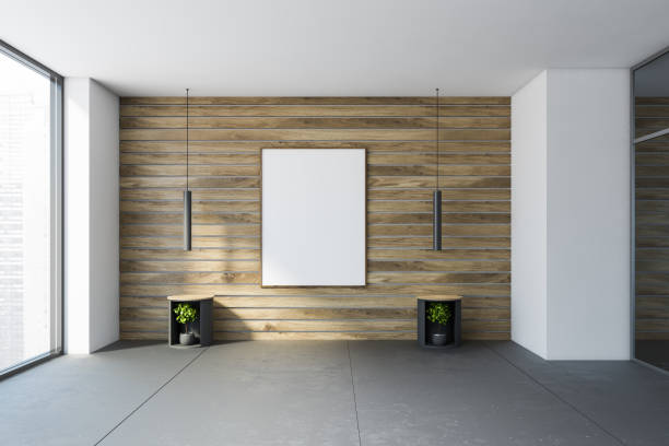 istock White and wooden empty living room with poster 1273732700