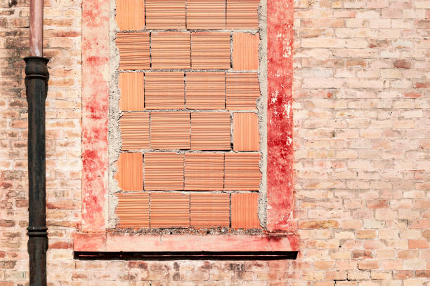 istock View of old building, bricked up window 1273734082