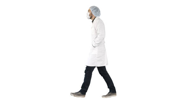istock Walking doctor puting medical mask on on white background 1273735351