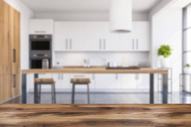 istock Table in blurry white and wooden kitchen 1273735385
