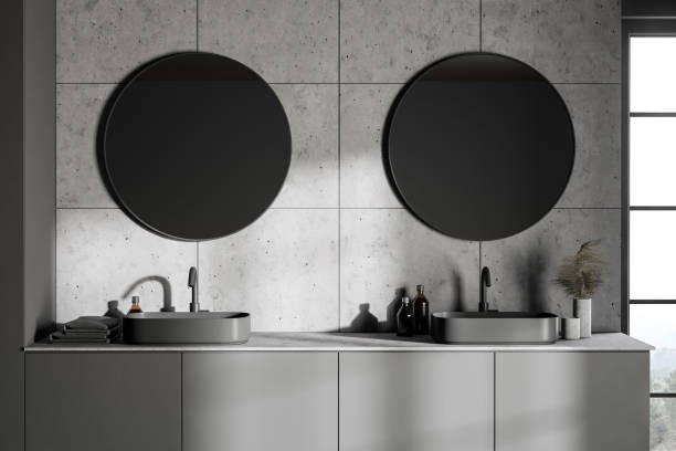 istock Double sink in grey bathroom with round mirrors 1273735768