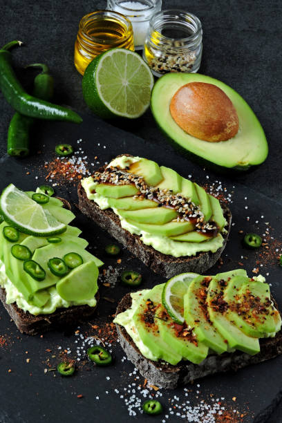 istock Healthy avocado toasts with beautiful toppings. 1273735812