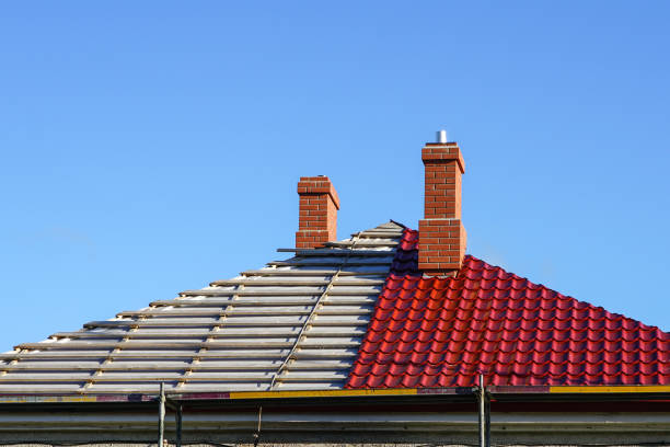 roof replacement of a residential house, half replaced, half not yet replacement of the roofing of a residential house on a background of blue sky, half changed, half not yet red brick tile stock pictures, royalty-free photos & images
