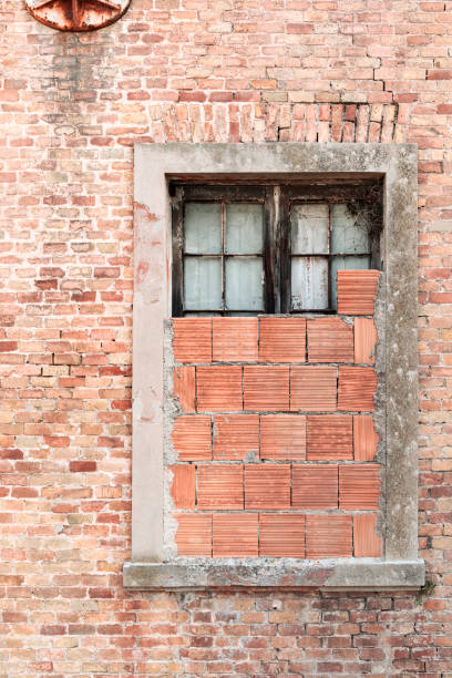 istock View of old building, bricked up window 1273737351