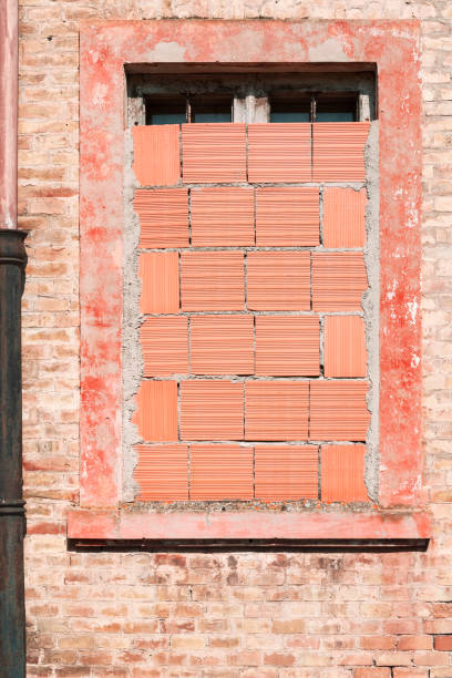 View of old building, bricked up window