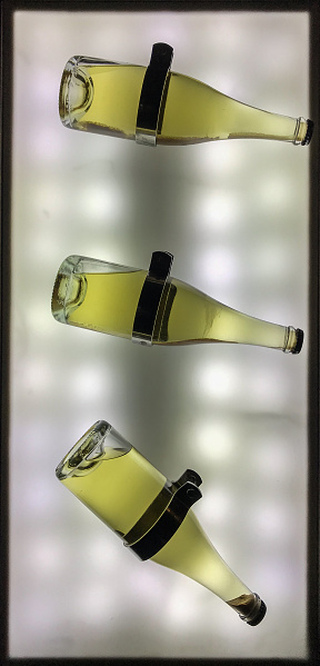 Sparkling wine bottles. Diagonal pattern on the lightbox