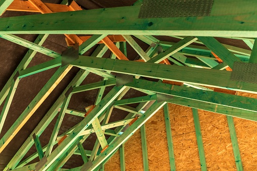 Detail of roof beams. construction of a family house. New roof. Wooden impregnated beams.