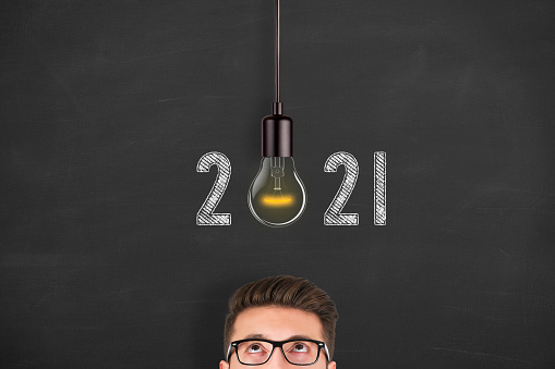 New Year 2021 Idea Concepts over Human Head on Blackboard Background