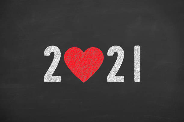 istock New Year 2021 with Heart Shape on Chalkboard Background 1273748092
