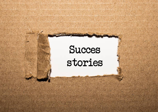 istock The text SUCCESS STORIES. behind torn brown paper 1273748749