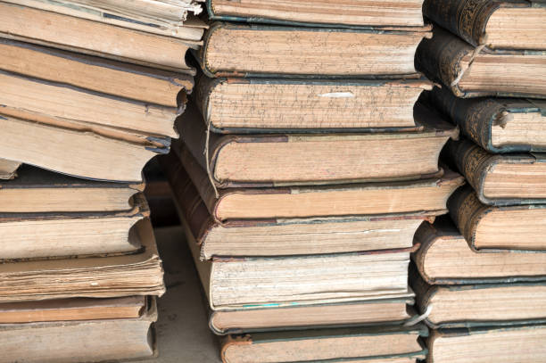 istock piles of old books in the library 1273748782